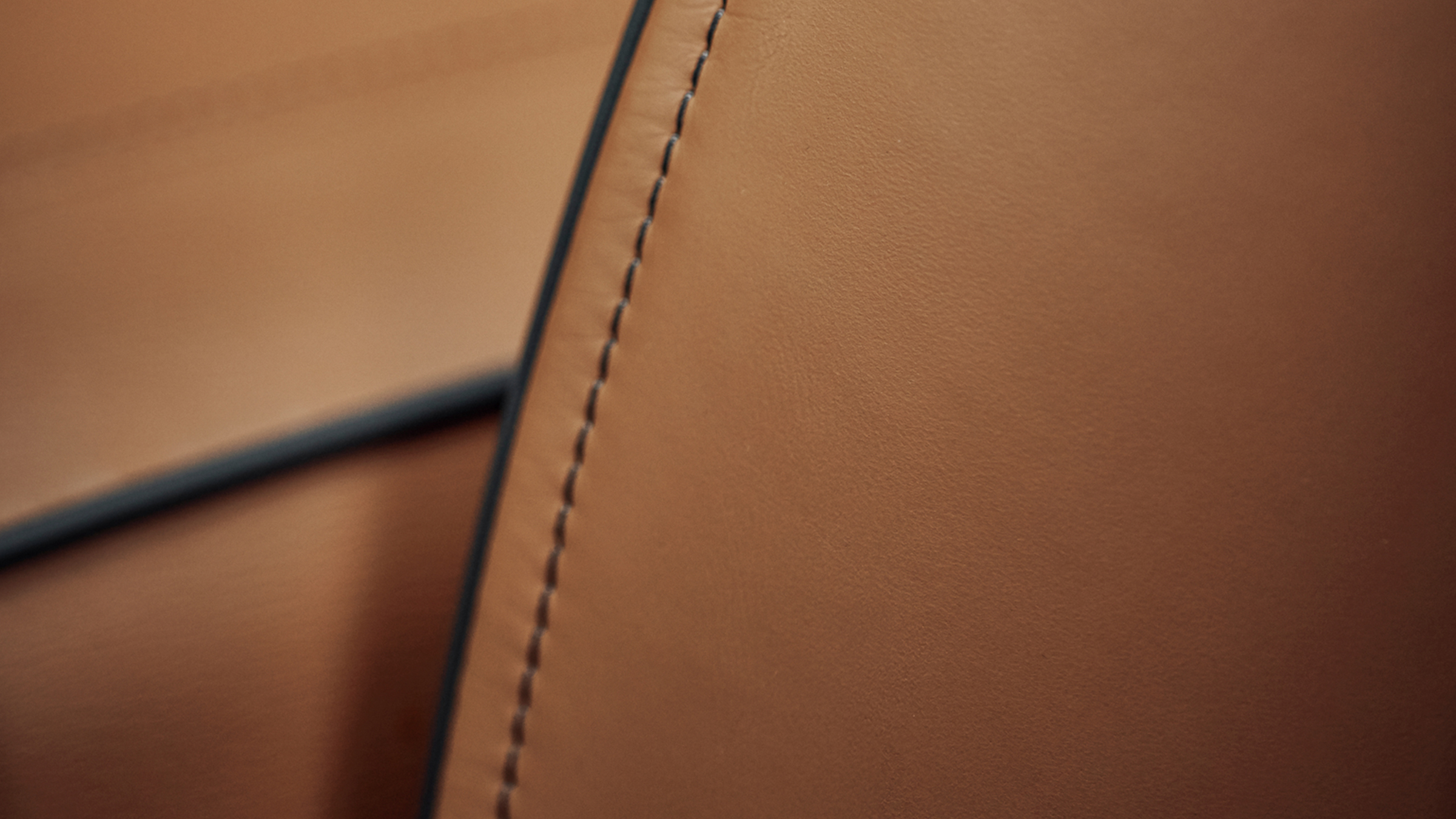 Close-up of 2022 INFINITI QX80 SUV leather stitching.